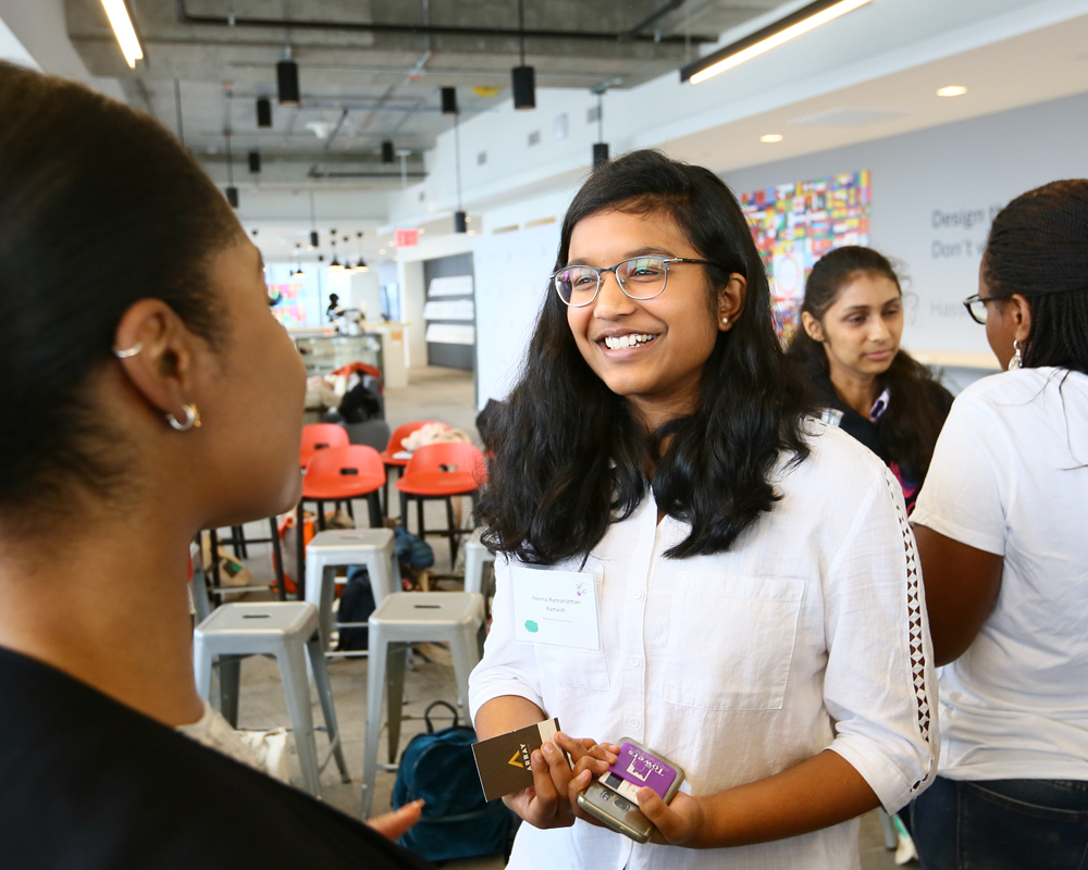 Girl meeting another STEM participant