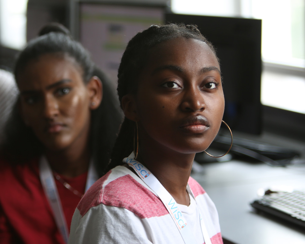 (headshot )a girl look straight and have full attention of what is ahead of her