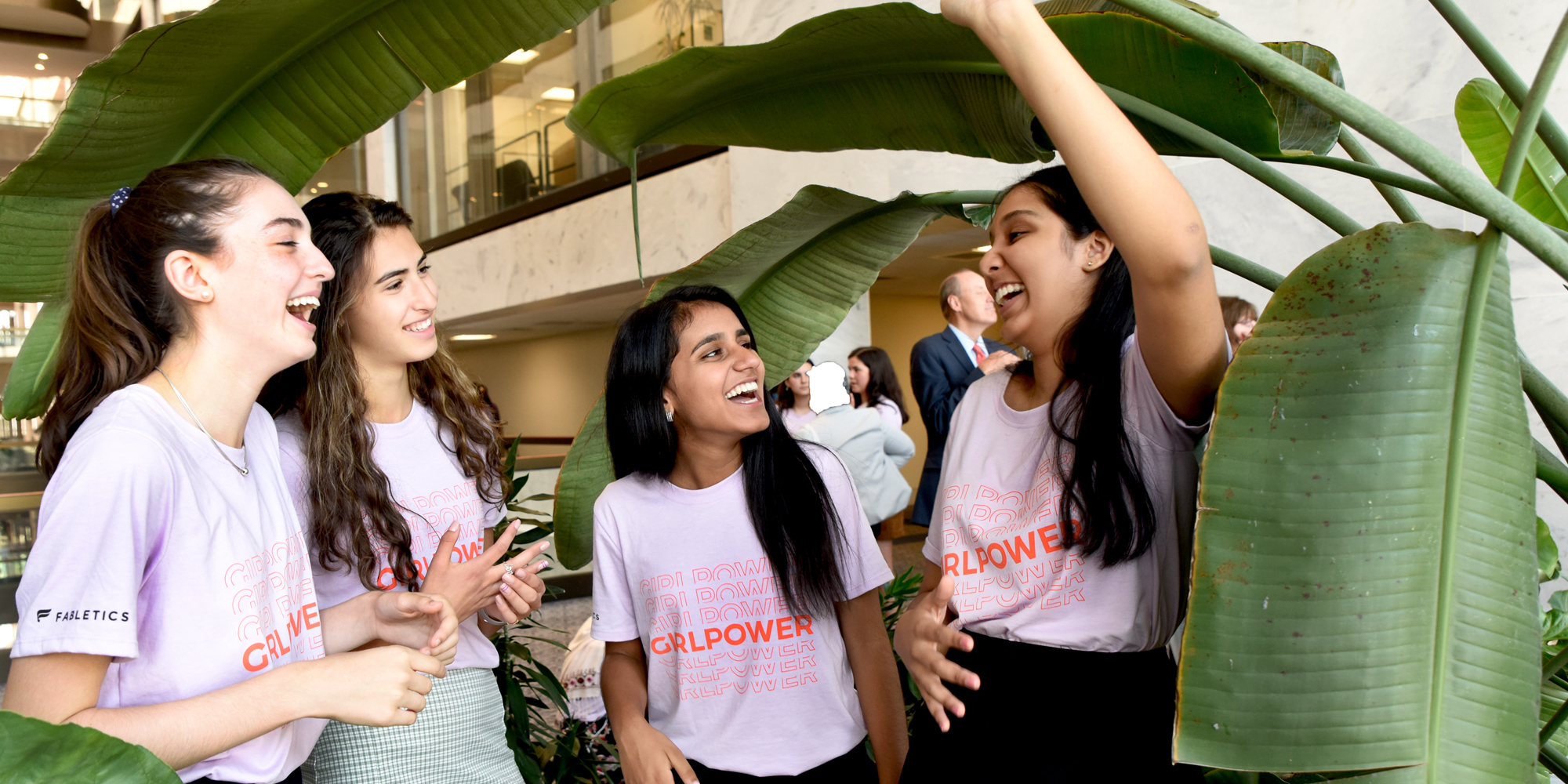 4 girl up girls talking to each other and laughing