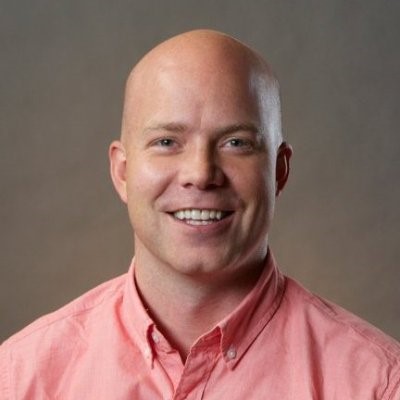 Advisory Council Davis Smith with upper body headshot and grey background