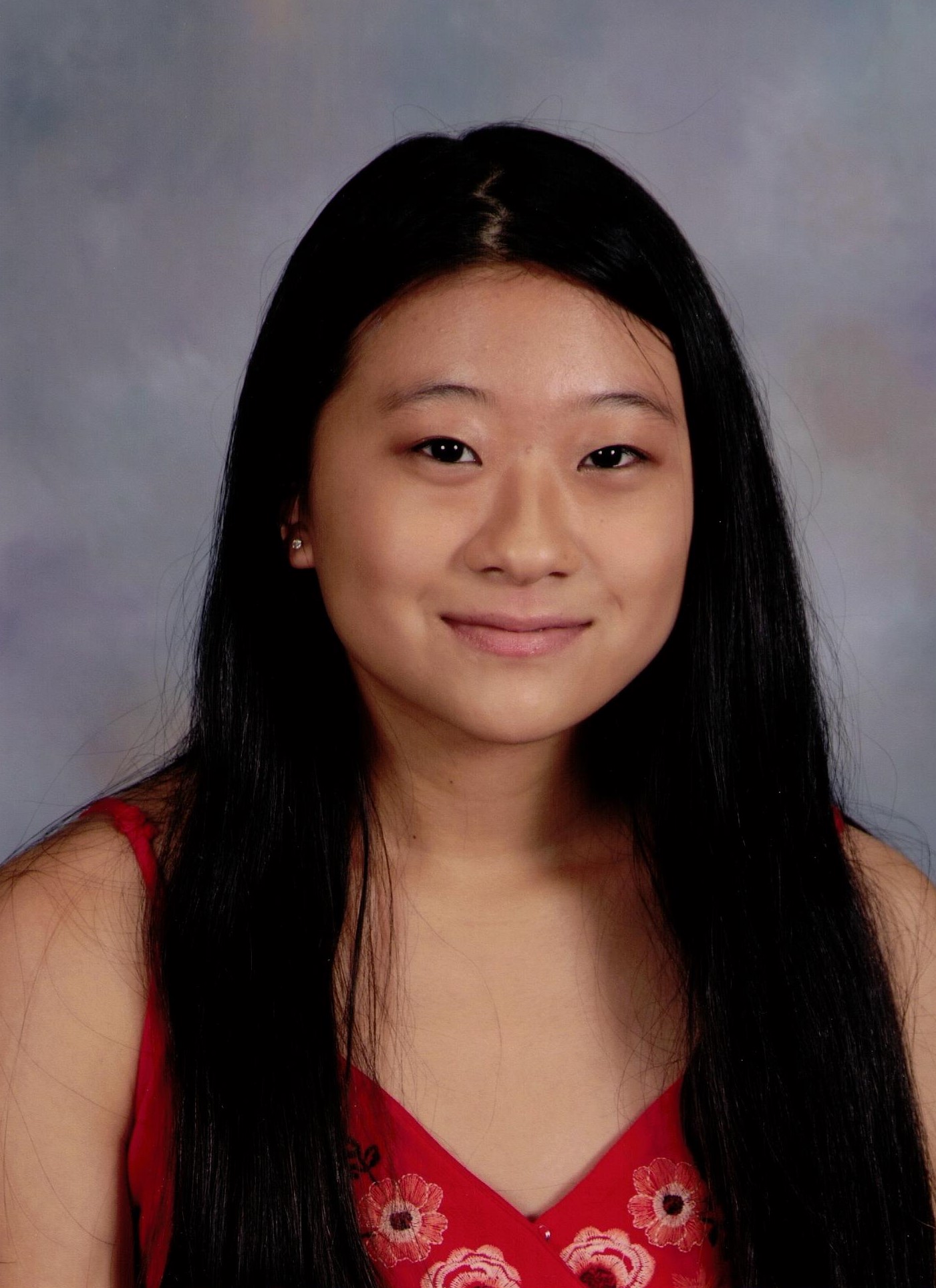 Felicia Xiong 2019-2020 Teen Advisors (headshot, school picture) with her smiley face facing to the camera and background is grey