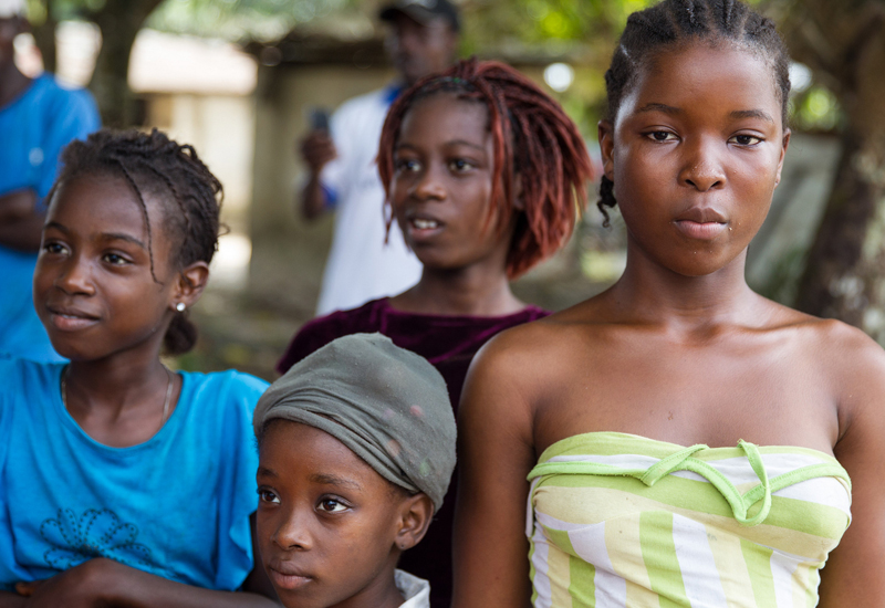 4 girls of different ages and 3 girls showing their side face and one girl face directly to the camera