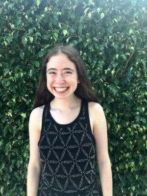 Rachel Auslander, Co-Chair 2017-2018 Teen Advisors (half body headshot, blurry picture) with greenery picture