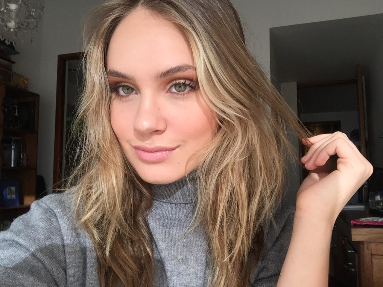 Salomé Beyer 2019-2020 Teen Advisors (very close headshot) with her smiley face facing to the camera, and her left hand touching her hair