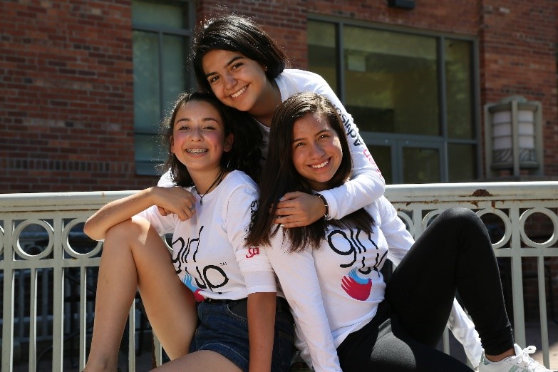 3 girl up girls wearing girl up teen advisor t-shirt