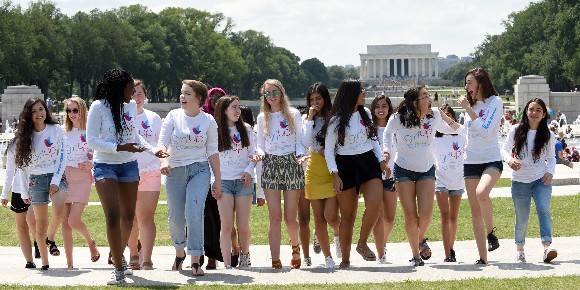a Group of Teen Advisors walking with the lincoln memorial in background