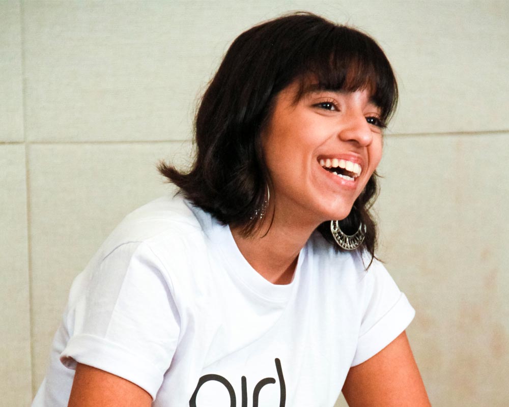 a girl with big smile on her face wearing Gril Up t-shirt (close shot)