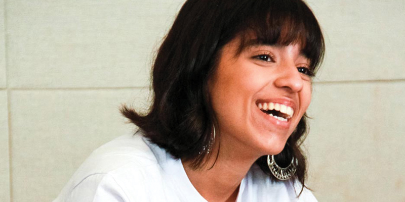 a girl with big smile on her face wearing Gril Up t-shirt (close shot)