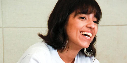 a girl with big smile on her face wearing Gril Up t-shirt (close shot)