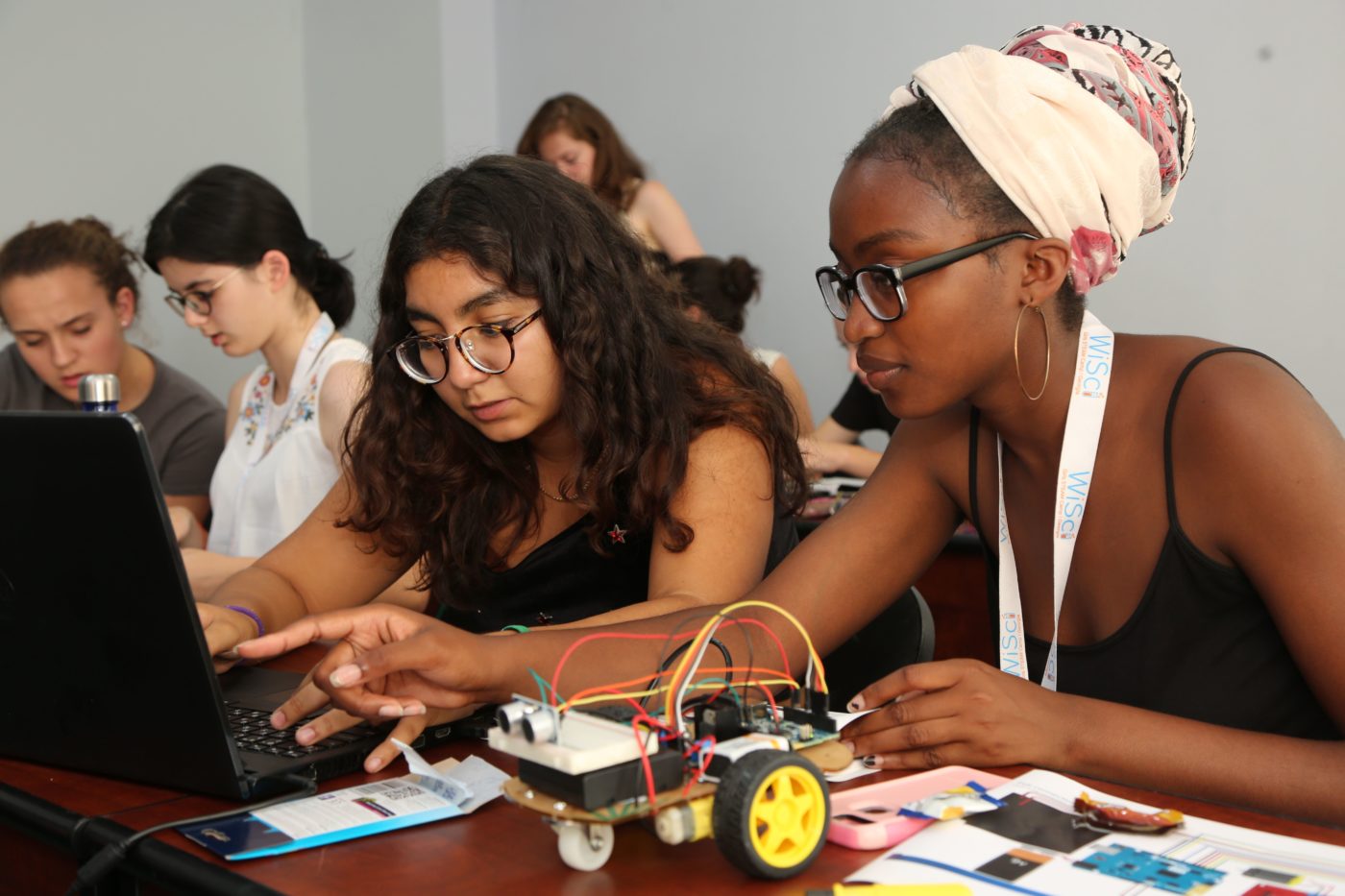 two Girl Up girls working on a STEM project with their computer (WiSci Summit)