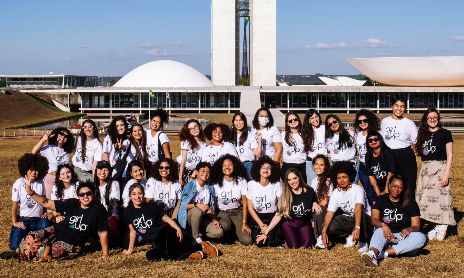 Girl Up Brasil staff in front of Brasil's parliament
