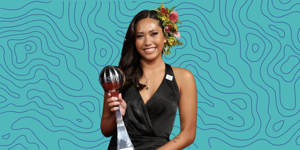 A photo of Ashley Badis holding her ESPY award